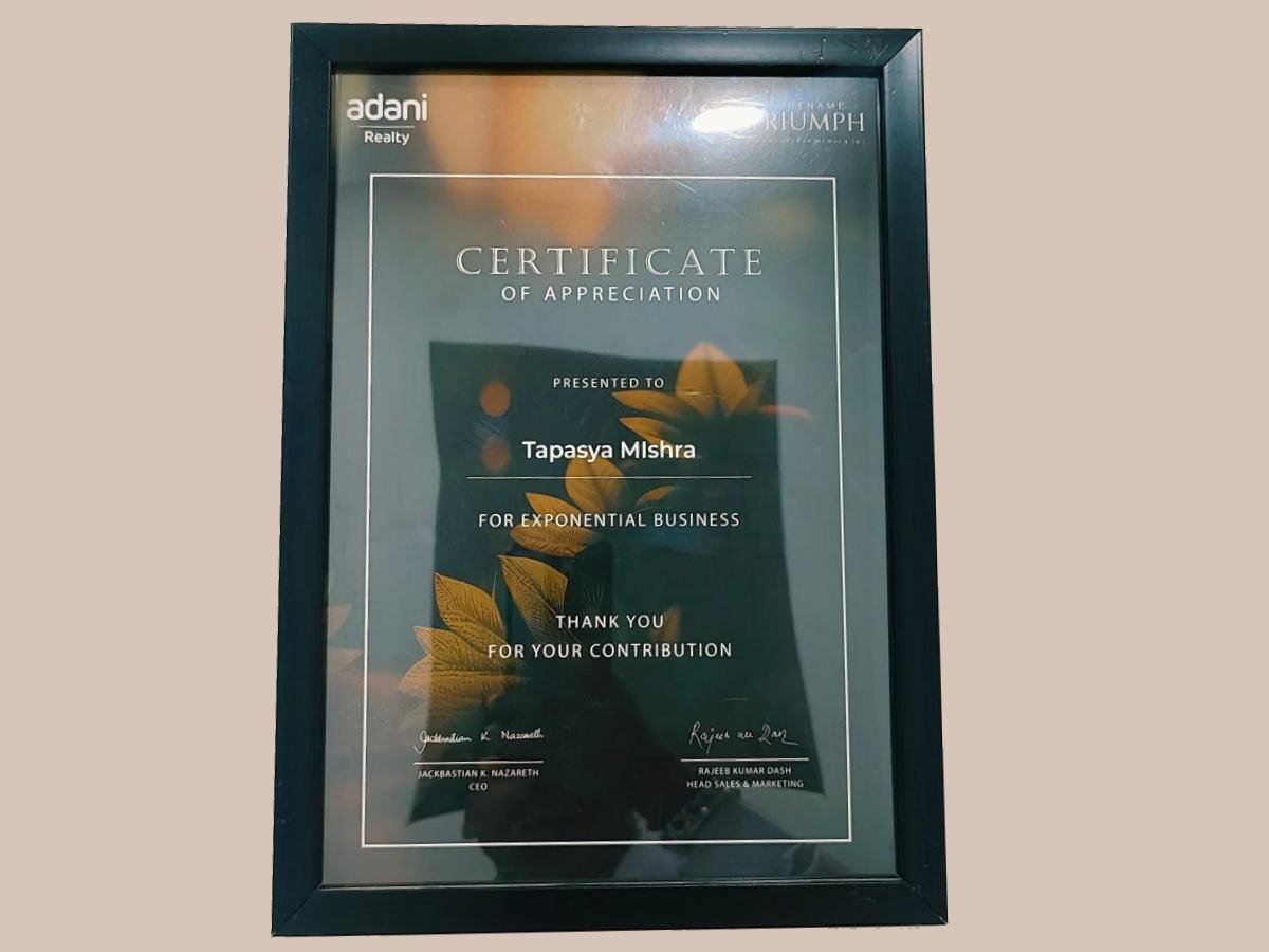 Adani Realty certificate of appreciation presented to Tapasya Mishra